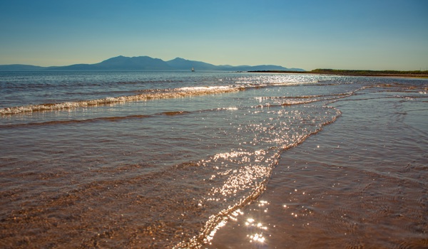 Portencross Beach in Ayrshire Scotland on a Sunny Summer Day with View to the Isle of Arran